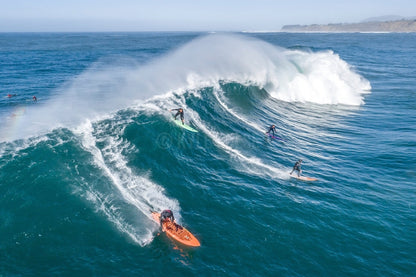 Dropping into a Mavericks Party Wave